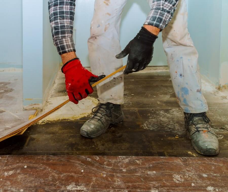 Person taking the tile floor off